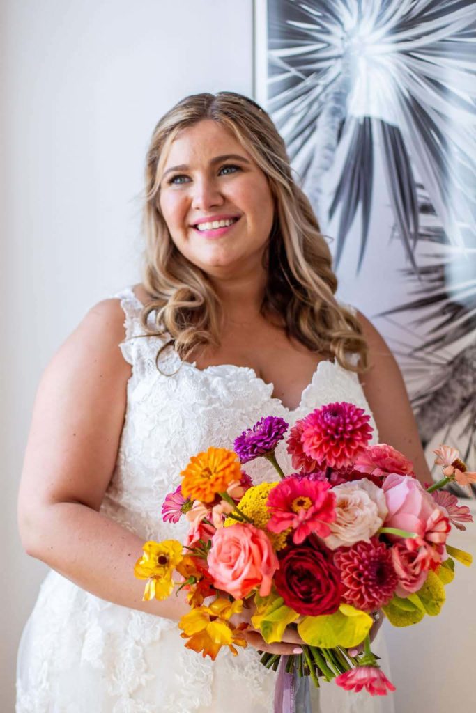 Bride with bright colorful bouquet at The Ruby Street