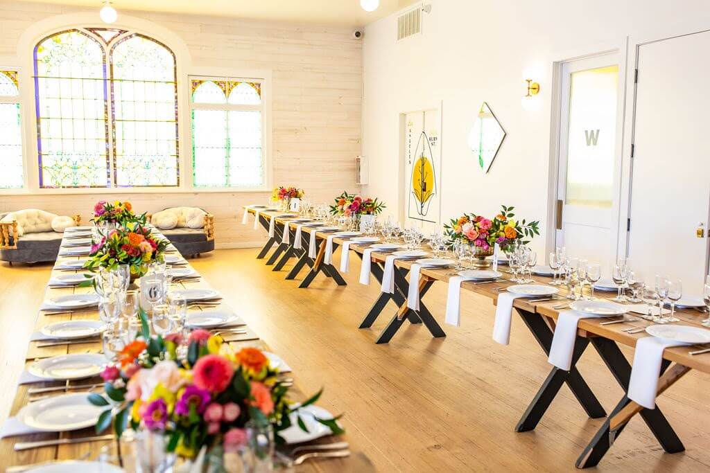 Colorful centerpieces in reception are of The Ruby Street