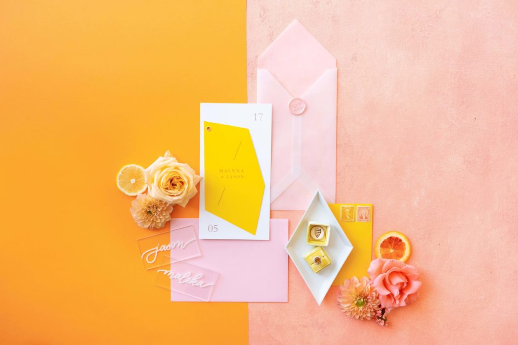 Colorful wedding invitation suite with pink and yellow color blocked design