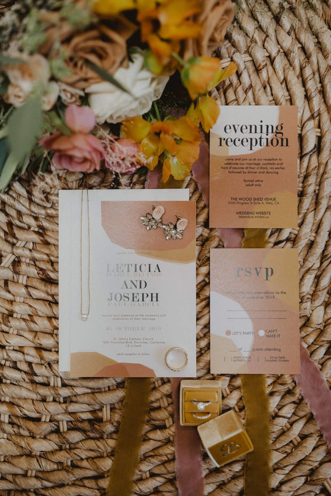 Modern Fall wedding invitation suite with a colorful Fall bouquet with orange mauve and yellow flowers