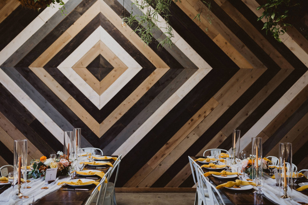Fall wedding reception with orange golden yellow and citrus at The Wood Shed
