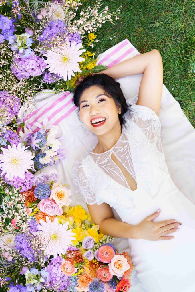Asian bride with colorful Spring flowers