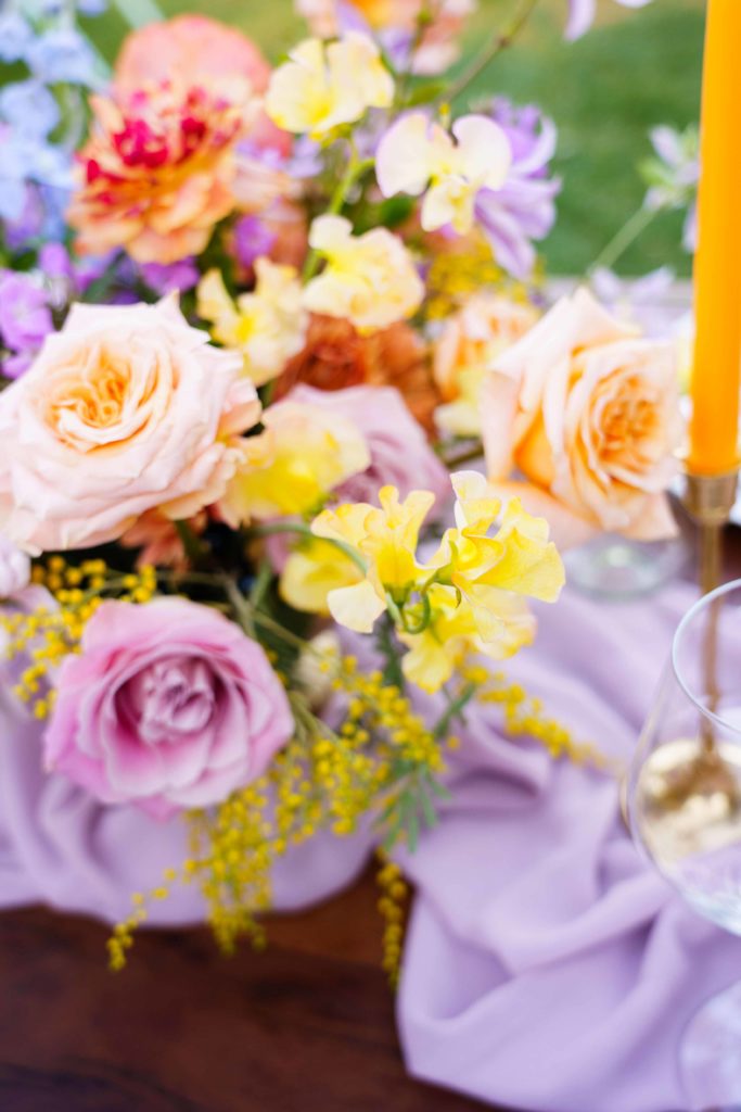 Colorful wedding centerpiece with pastel flowers