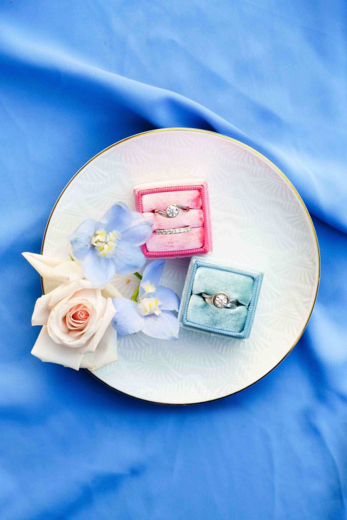 Pink and blue velvet ring boxes for a Lesbian couple engagement
