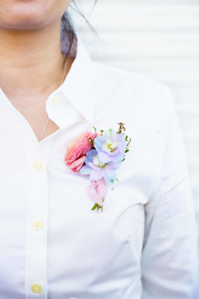 Boutonniere with pastel colored flowers