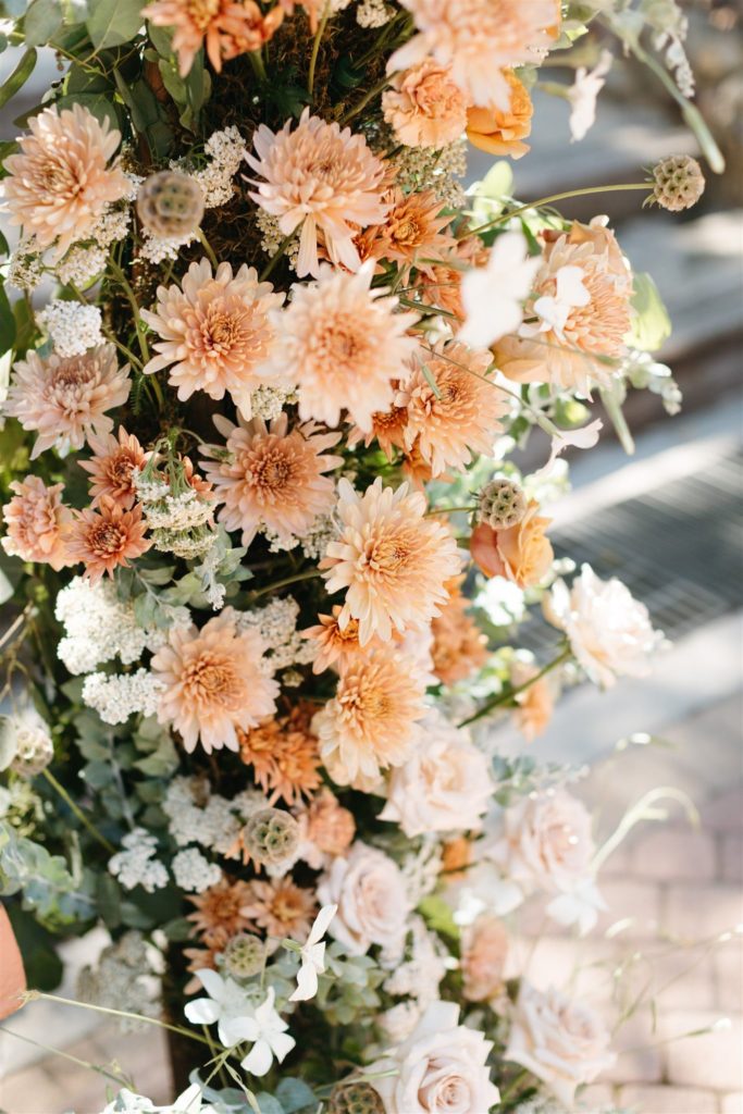 Peach flowers for wedding arch at Rancho Las Lomas wedding