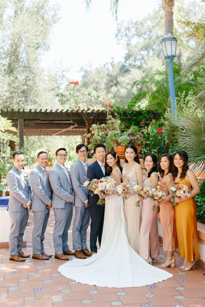 Bride and groom with wedding party at Rancho Las Lomas wedding in Southern California