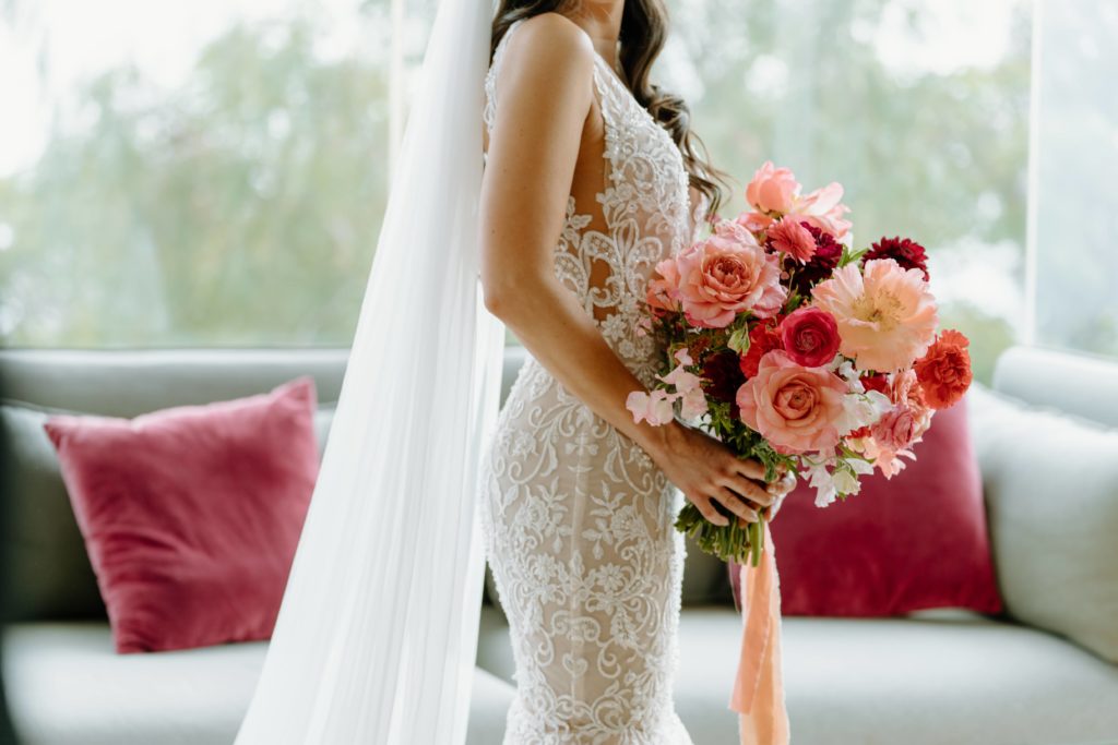 Bride holding fresh floral bouquet for Malibu wedding