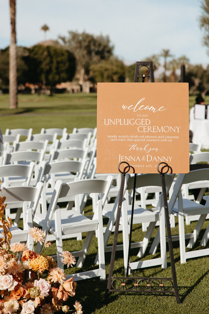 Unplugged wedding ceremony sign on easel