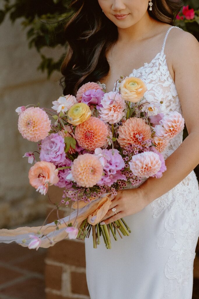 Colorful pastel weddin bouquet with dahlias and ranunculus 
