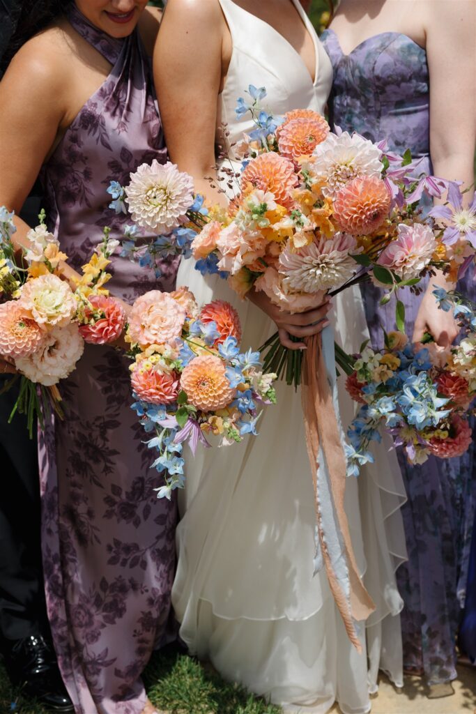 bride and bridesmaids bouquets with dahlias designed by urban marigold